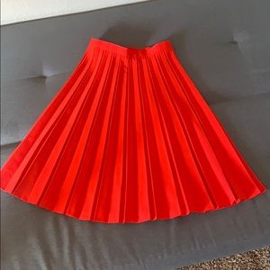 Red pleated skirt